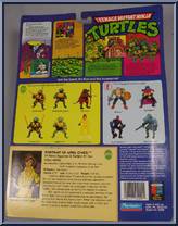 April O' Neil (Orange & Blue Stripe) [Reissue] from Teenage Mutant Ninja Turtles - 1998 - Basic Figures manufactured by Playmates [Back]